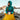 Woman sitting in a sleeping bag on the side of a mountain